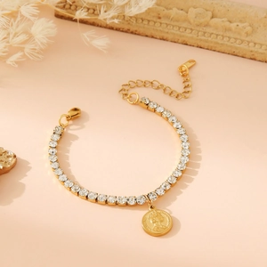 Gold tennis bracelet with square crystals and a relief coin pendant for women and men