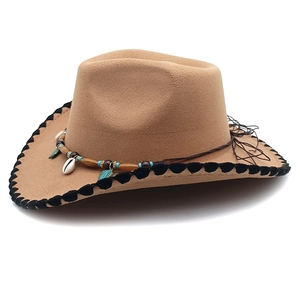 Detail of western cowboy hat with seashell bead trim and black wavy crochet edges