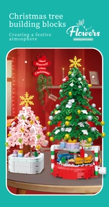 Close-up of classic green and sakura pink Christmas tree building blocks with festive ornaments