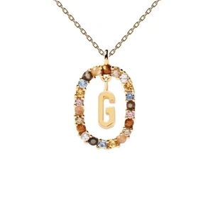 Detail of gold letter G necklace pendant with colorful zircon stones on white background