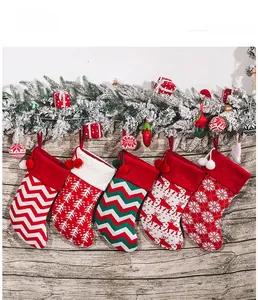 Detail of five assorted knitted Christmas stockings with festive snowflake patterns