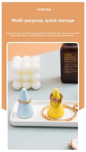 Three-piece ceramic ring cone stand set with blue and yellow cones on a white tray