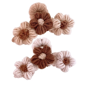 Handmade crochet flower hair claw clips in brown and cream knit for autumn women