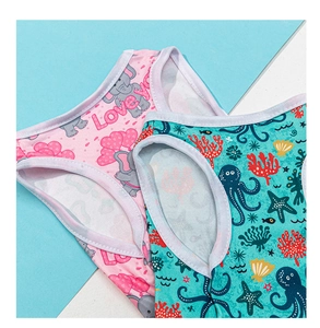 Detail of breathable cotton dog vests with cute elephant and ocean animal patterns