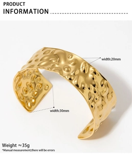 Detailed view of wide golden hammered texture cuff bracelet with size specifications