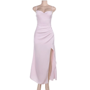Detail of a light pink satin dress featuring elegant ruching and a high side slit design