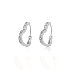 Close-up of heart-shaped huggie earrings with white cubic zirconia pavé in silver finish