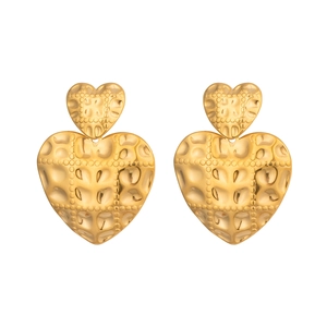 Vintage gold heart earrings with hammered texture and artistic embossed patterns