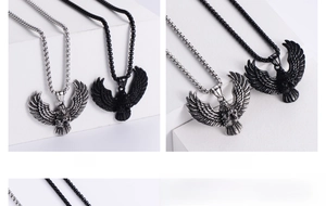 Detail view of retro eagle pendants in silver and black stainless steel for men