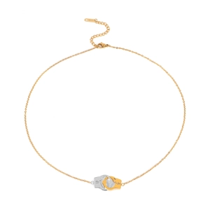 Detail of interlocking handcuff pendants in gold and silver finish with S.Steel tag