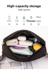 Detailed top view of a black nylon crossbody bag showing its large interior storage capacity