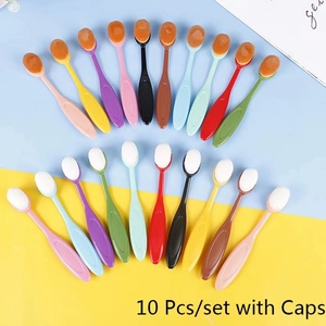 Set of 10 colorful oval makeup brushes with protective caps on a vibrant background