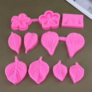Detailed set of 9 pink silicone fondant molds featuring diverse flower and leaf vein textures