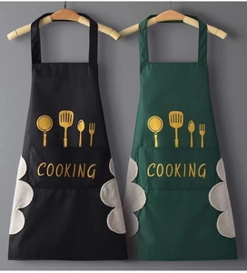 Detail of waterproof aprons with coral fleece hand towels and gold cooking print
