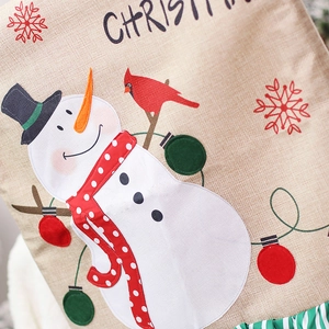 Linen Christmas chair cover featuring an embroidered snowman with a festive red bird