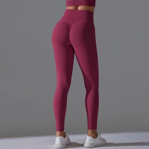 Close-up of seamless scrunch butt yoga leggings in dark rose with high waist shaping