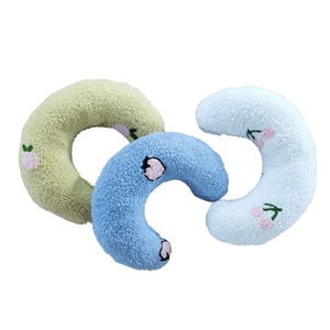 Three plush lamb wool pet pillows with fruit embroidery in green, blue, and white colors