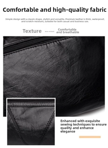 Détail du sac en cuir noir avec texture grainée et finitions de couture robustes