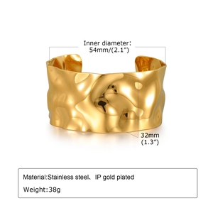 Detail view of gold stainless steel cuff bracelet with hammered texture and dimensions