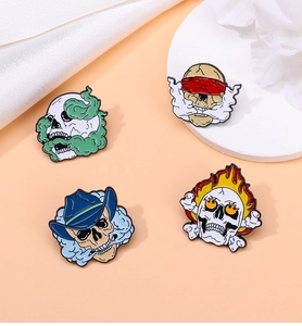 Detail of colorful enamel punk skull pins including cowboy hat and flaming crossbones