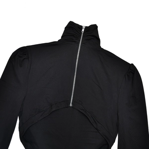Detailed back view of black high neck dress featuring silver zipper and cutout design