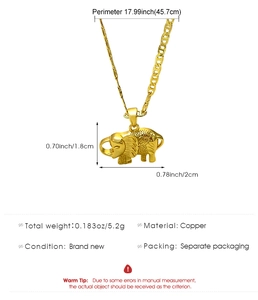 Detailed macro view of golden elephant pendant showing fine textures and precise dimensions