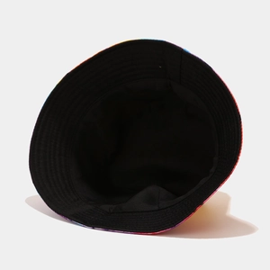 Detailed close-up of a reversible tie-dye bucket hat with a black inner cotton lining