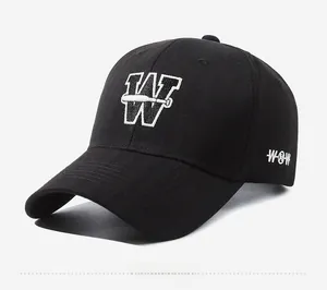 Detail of black cotton baseball cap with white 3D W letter embroidery and side WOW text