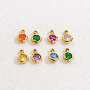 5mm stainless steel gold charms with colorful zircon stones in a neat grid display