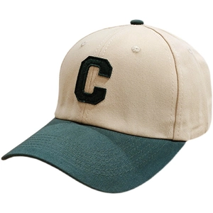 Two-tone beige and dark green baseball cap featuring a premium embroidered letter C