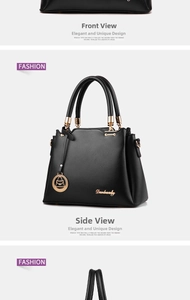 Detail of black leather handbag featuring golden hardware and elegant metallic accents