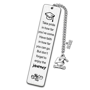 Close-up of engraved stainless steel bookmark with graduation quotes and 2022 charms