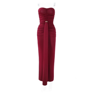 Detailed close-up of ruched burgundy strapless maxi dress with gold metal ring hardware