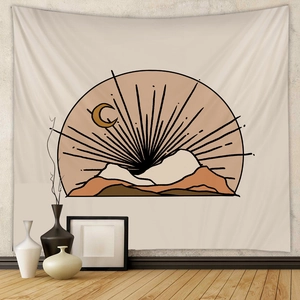Detail of Boho wall tapestry with minimalist sun and mountain landscape on fabric