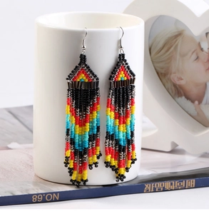 Macro view of multi-layered beaded tassel earrings with bohemian geometric details
