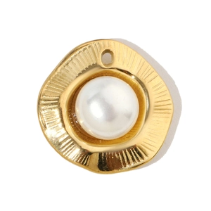 Detailed view of a golden irregular pendant featuring a large white central pearl inlay