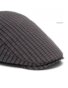 Detail of British plaid beret featuring a widened foldable brim and black-white texture