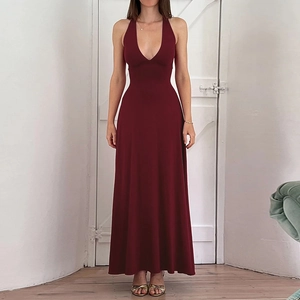 Detailed view of the slim-fit wine red halter neck dress with a deep V-neck and open back