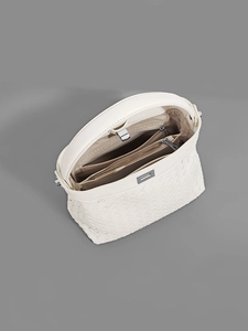 Beige woven leather handbag with multi-layer interior compartments and crossbody strap