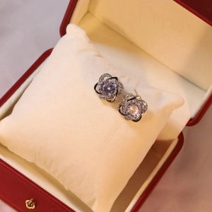 Elegant silver flower stud earrings set with large round zircon in a luxury red gift box