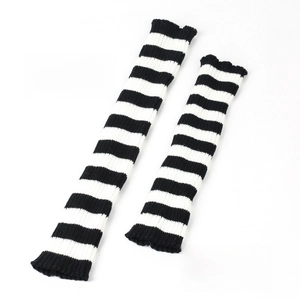 Detail of striped knit leg warmers showing comparison between extra long and regular lengths