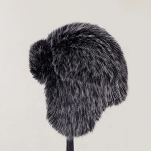 Detailed texture of charcoal grey faux fur winter trapper hat with soft plush finish