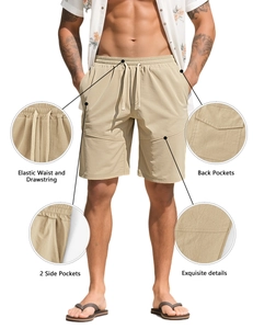 Detail view of khaki sports shorts with elastic drawstring waist and side pockets