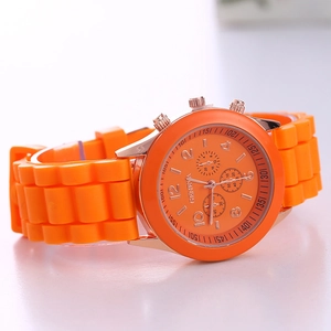 Detail of Geneva orange silicone sports watch with rose gold case and quartz dial