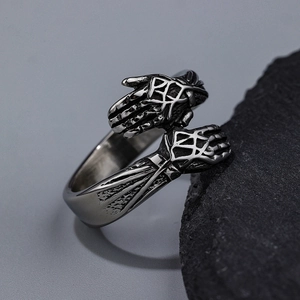 Retro punk style hugging hands metal ring for men with vintage silver finish on black rock