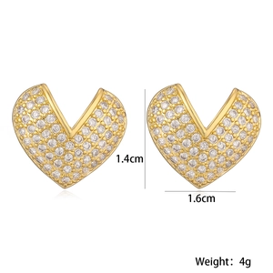 Detail view of heart-shaped gold-plated copper earrings with size and weight parameters
