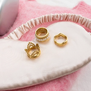 Three-piece 18K gold plated stainless steel lace crown and pearl rings set on silk