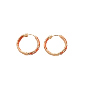 Minimalist gold hoop earrings with orange and white crystals on a clean white background