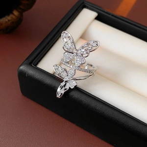Macro detail of silver hollow butterfly ring with sparkling zircons in a jewelry box
