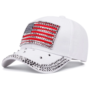 Detail of USA flag rhinestone patch and silver spiked rivets on white baseball cap